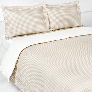 Picnic Gingham Full/Queen Duvet Cover in the Beige Print displayed on bed. Shown with two standard size pillow cases in the same print.