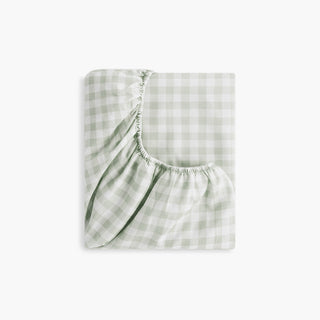 Green and white checkered fabric on a white background