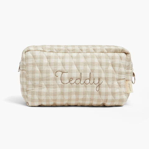 Quilted pouch with 'Teddy' embroidery on a white background