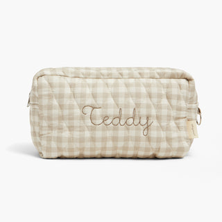 Quilted pouch with 'Teddy' embroidery on a white background