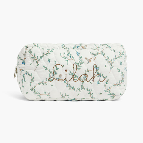 Quilted pouch with floral patterns and 'Lilah' embroidery on a white background