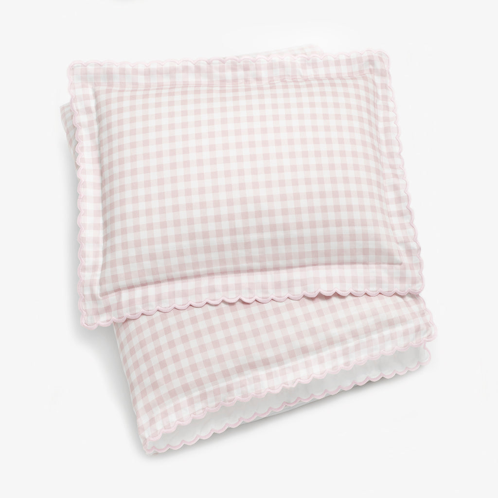 Personalize Me: Toddler duvet folded with toddler pillow on top in the Picnic Gingham in the color pink