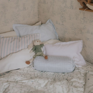 Bed with assorted decorative pillows