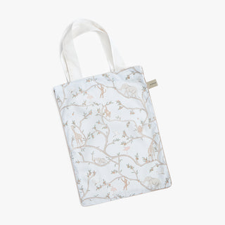 Light blue tote bag with Animal Parade pattern in blue on a white background