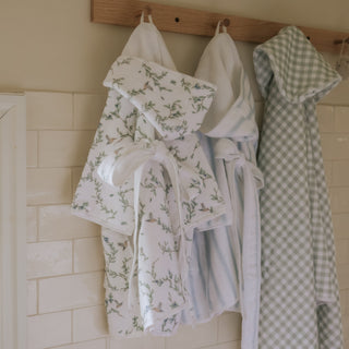 Hanging children's robes and towels