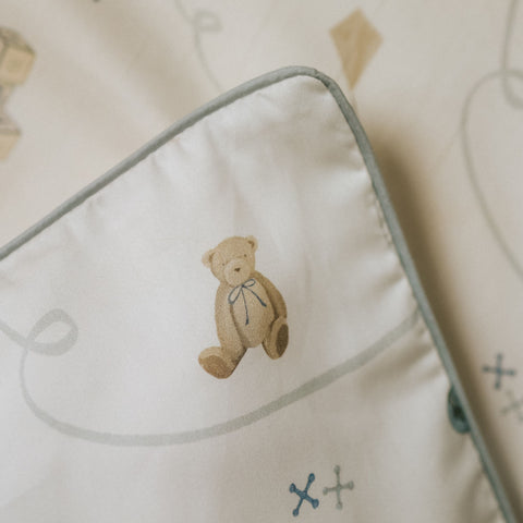 Close up of a teddy bear design on a pillow