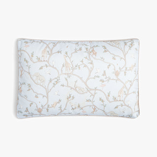 Rectangular pillow with floral pattern on a light blue background