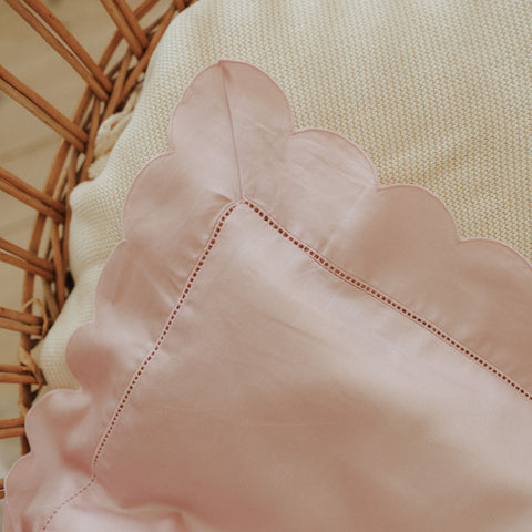 Scalloped Starlight Toddler Blanket in Rose in crib