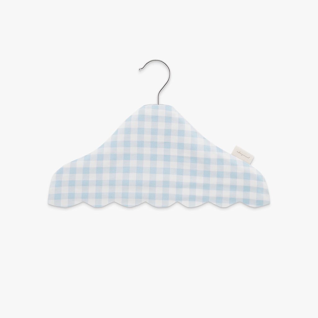 Blue and white checkered hanger on a light gray background