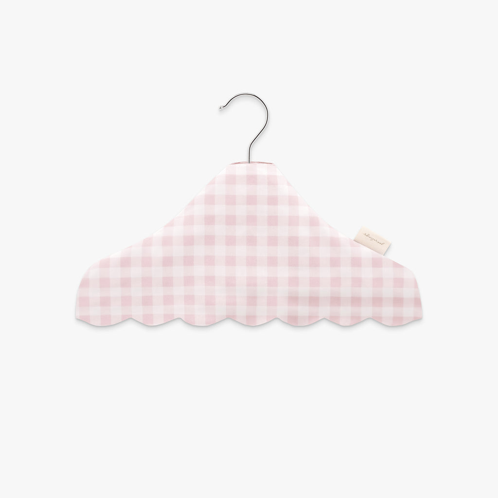 Pink gingham-patterned hanger on a white background
