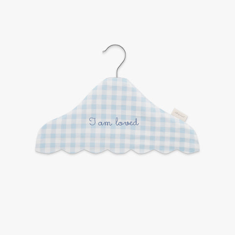 Blue and white checkered cloud-shaped hanger with 'I am loved' text on a white background