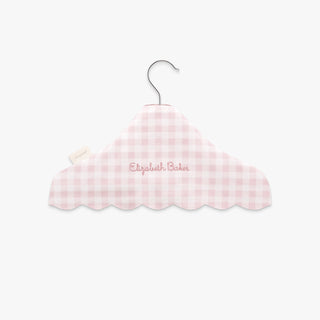 Pink gingham-patterned hanger with 'Elizabeth Baker' embroidery on a white background
