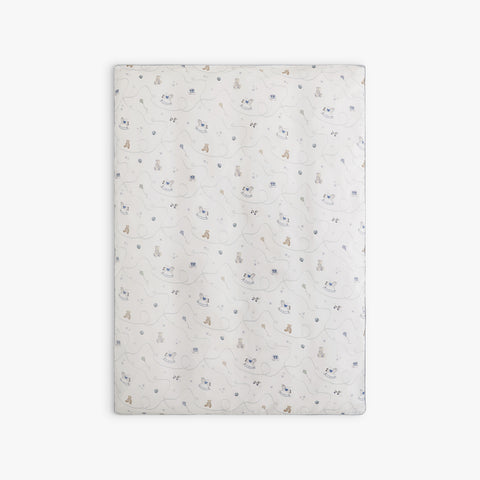 Rocking horse and teddy bear patterned blanket on a white background