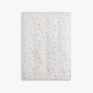 Rocking horse and teddy bear patterned blanket on a white background