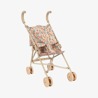 Floral stroller with pink handles and wheels.