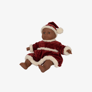 Baby doll in a red outfit with white trim on a white background