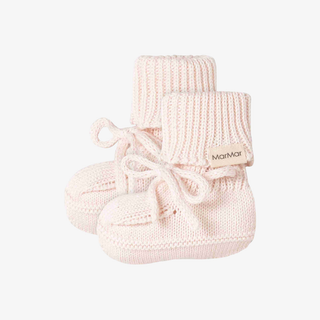 A pair of pale pink knit baby booties with lace-up fronts.