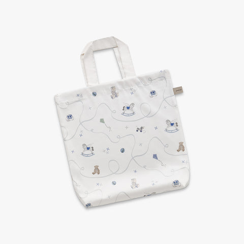 White tote bag with teddy bear pattern on a white background