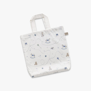 White tote bag with teddy bear pattern on a white background