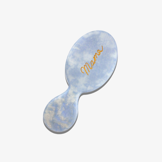 Baby blue marble-textured hairbrush with 'Mama' engraving on a white background