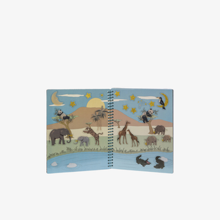 Open book with illustrations of animals in a desert landscape on a white background