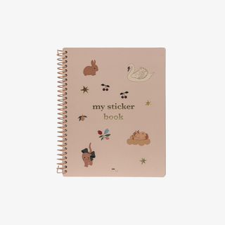 Sticker book with animal illustrations on a beige background