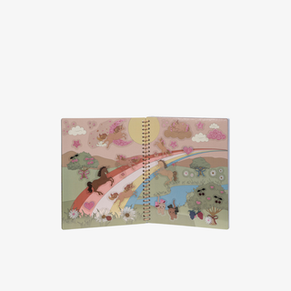 Notebook with a colorful illustration of animals on a rainbow on a white background