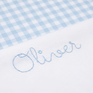 Embroidered name 'Oliver' on a blue and white checkered fabric background