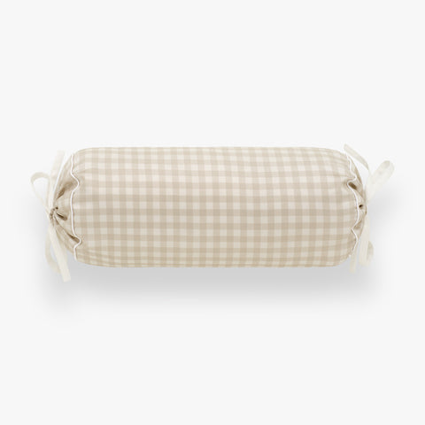 Checkered cylindrical pillow on a white background