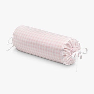 Pink checkered cylindrical pillow on a white background