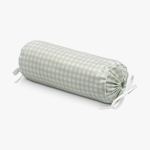 Green checkered cylindrical pillow on a white background