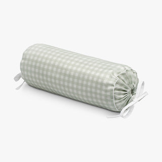 Green checkered cylindrical pillow on a white background