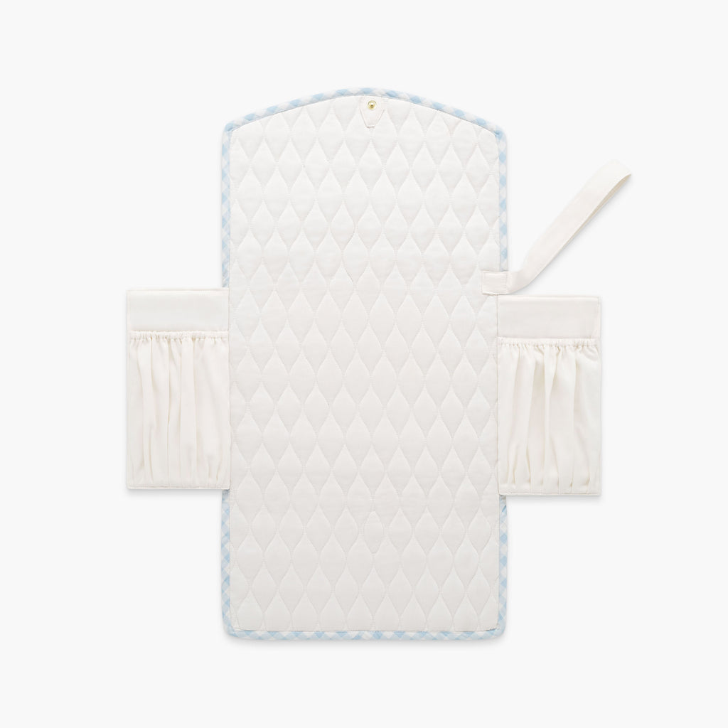 Portable Changing Pad in Blue Gingham. Inside is Ivory with pocket detail