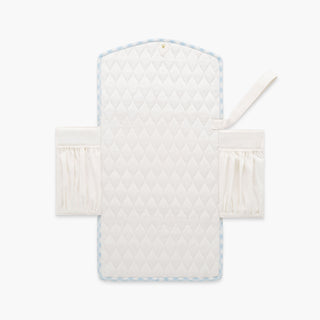 Portable Changing Pad in Blue Gingham. Inside is Ivory with pocket detail
