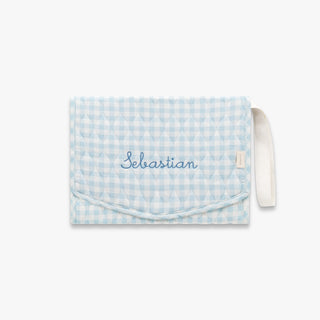 Portable Changing Pad in Blue Gingham with "Sebastian" embroidered on the front. 