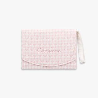 Portable Changing Pad in Pink Gingham with "Charlene" embroidered on the front.