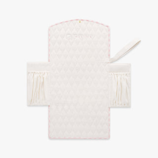 Portable Changing Pad in Pink Gingham. Inside is Ivory with pocket detail