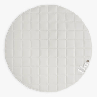 Round quilted playmat with striped pattern on a white background