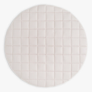 Round playmat with a subtle grid pattern on a white background