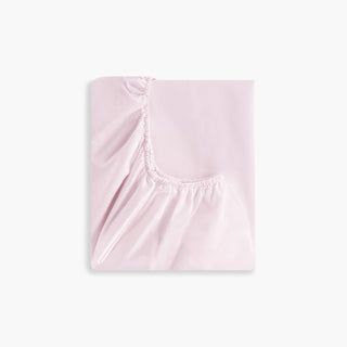 Solid Soft Pink fitted sheet on a white background