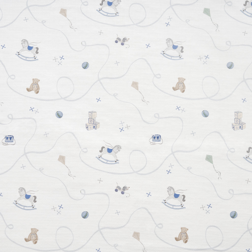 White fabric with patterns of teddy bears and rocking horses on a white background