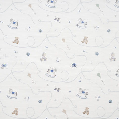 White fabric with patterns of teddy bears and rocking horses on a white background