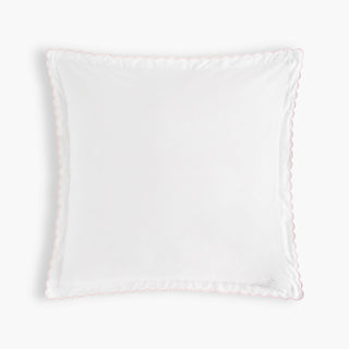 White decorative pillow on a light gray background