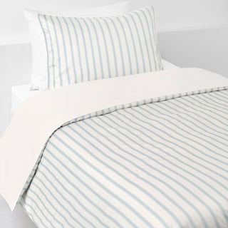 Striped bedspread and pillowcase set on a white background