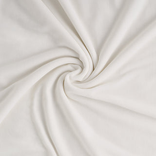 Close-up of white blanket with a swirl pattern