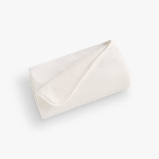 White folded blanket on a white background