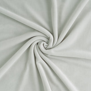 Close-up of light green fabric with a swirl pattern