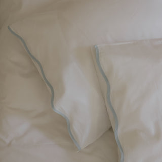 White pillowcases with blue edges 