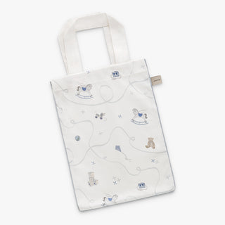 White tote bag with teddy bear and toy pattern on a white background