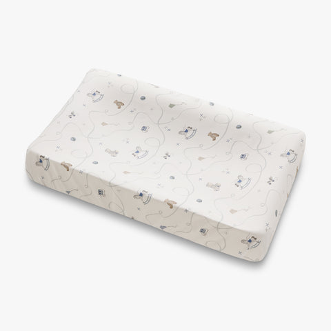 Baby changing pad cover with toys and animal pattern on a white background